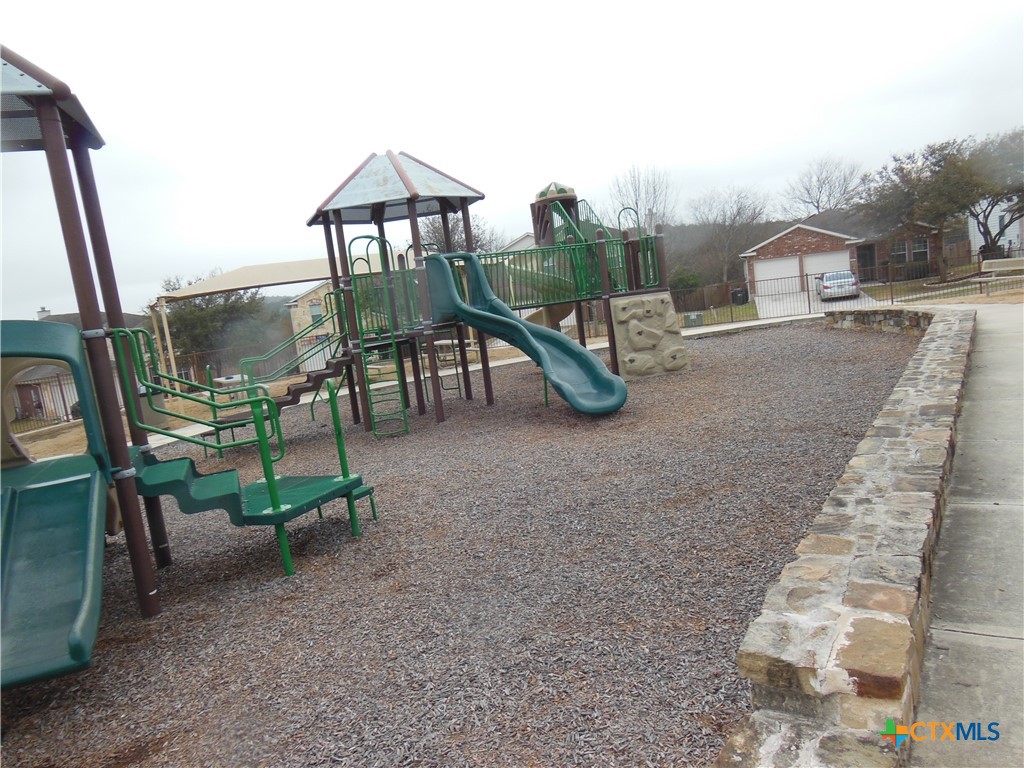 5244 Brookline Schertz, TX 78108 - Photo 22 of 24 a view of a house with backyard porch and sitting area