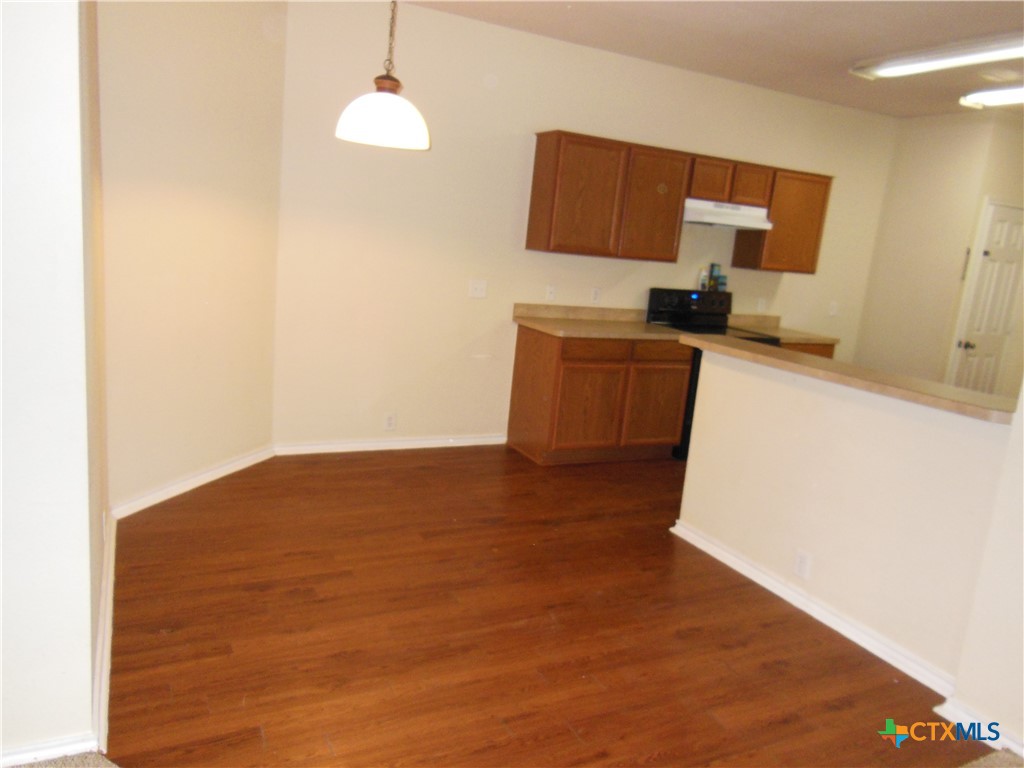 5244 Brookline Schertz, TX 78108 - Photo 6 of 24 a kitchen with a refrigerator and a stove top oven
