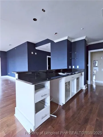 a kitchen with stainless steel appliances granite countertop a stove and a sink