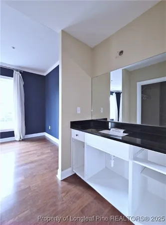 a view of a kitchen with a sink and a large window