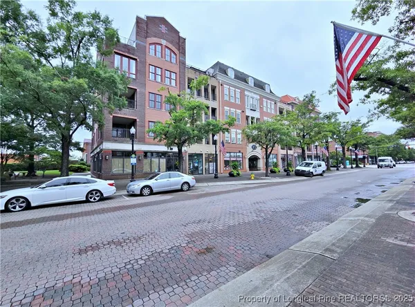 a view of a street with cars