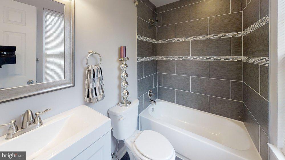610 Riden Street Odenton, MD 21113 - Photo 12 of 22 Custom tile designs featured in the bathrooms!