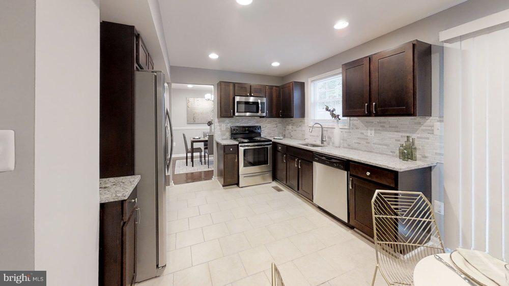 610 Riden Street Odenton, MD 21113 - Photo 3 of 22 Beautiful backsplash featured in the kitchen!