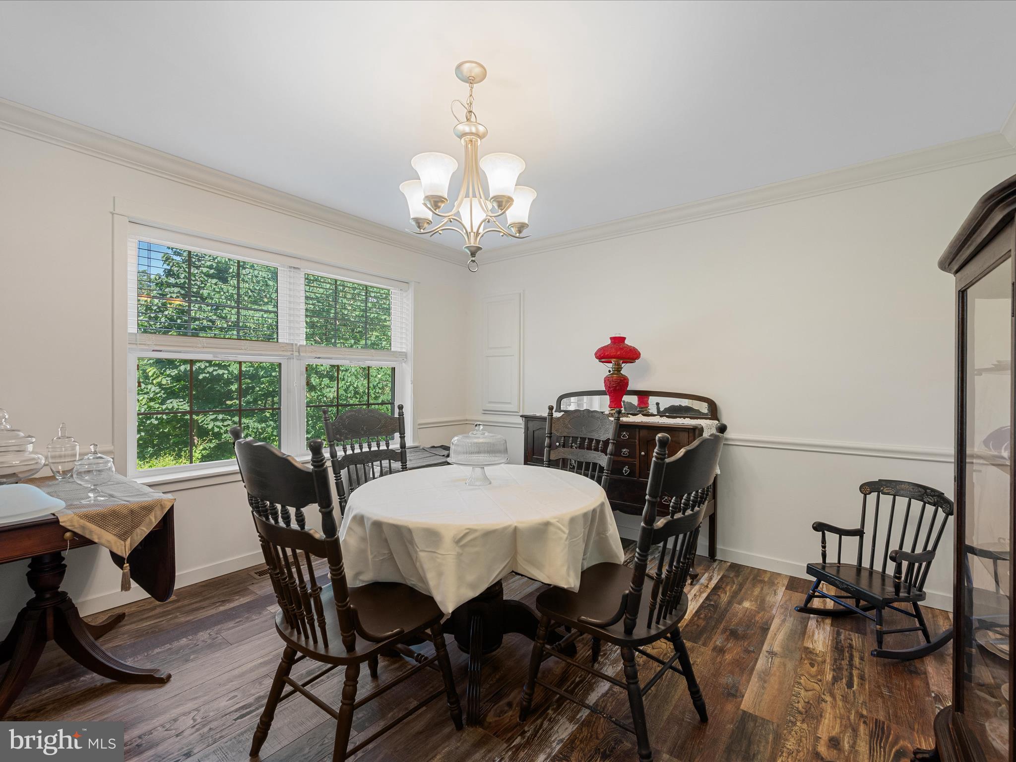 231 Greenfield Road Front Royal, VA 22630 - Photo 12 of 38 a view of a dining room with furniture a chandelier and wooden floor