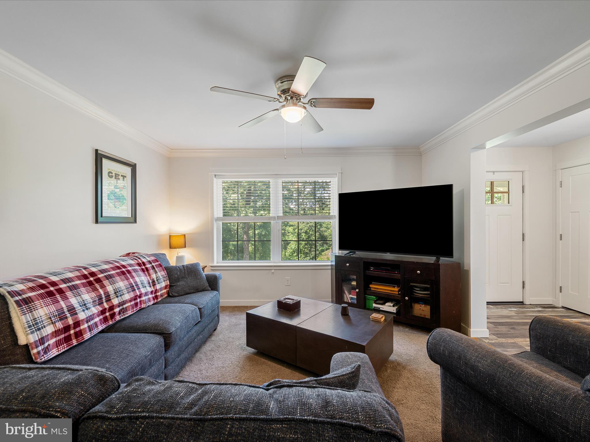 231 Greenfield Road Front Royal, VA 22630 - Photo 17 of 38 a living room with furniture and a flat screen tv