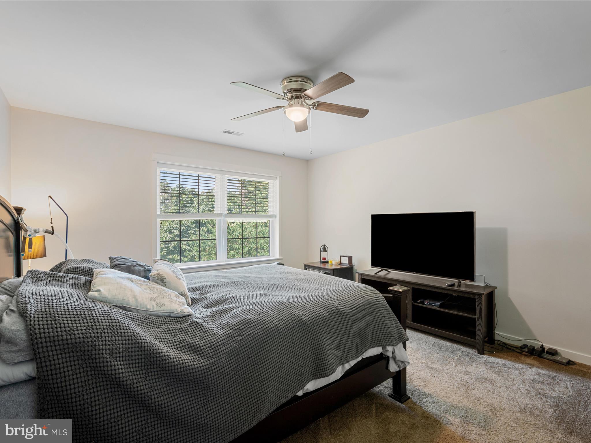 231 Greenfield Road Front Royal, VA 22630 - Photo 20 of 38 a bedroom with a bed and a flat screen tv