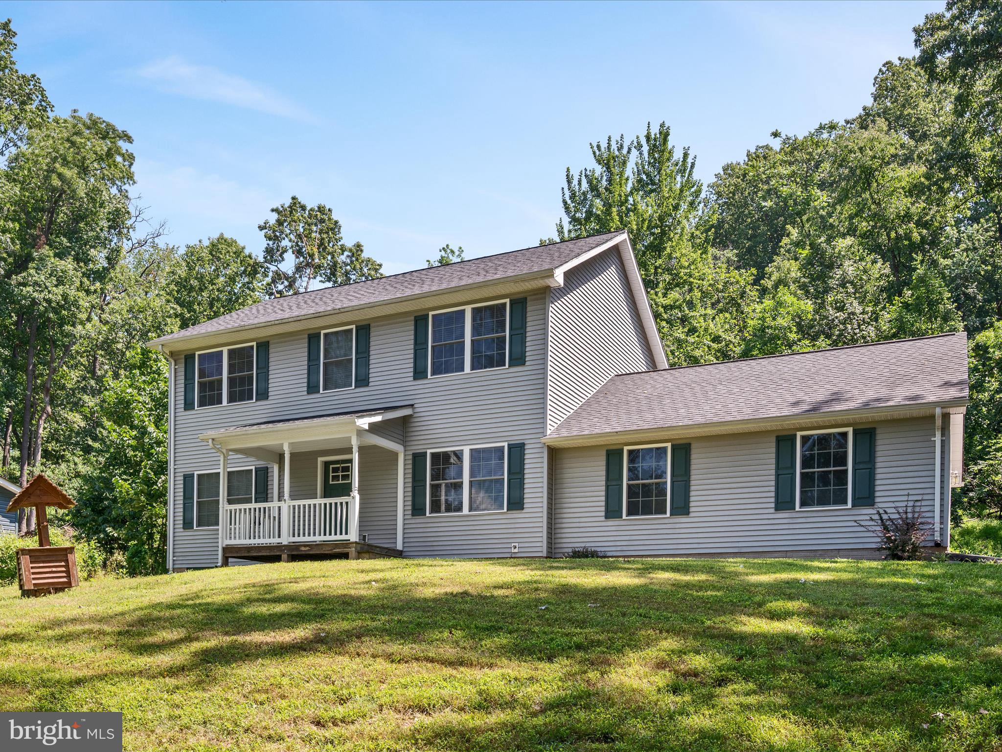 231 Greenfield Road Front Royal, VA 22630 - Photo 2 of 38 a front view of a house with a garden