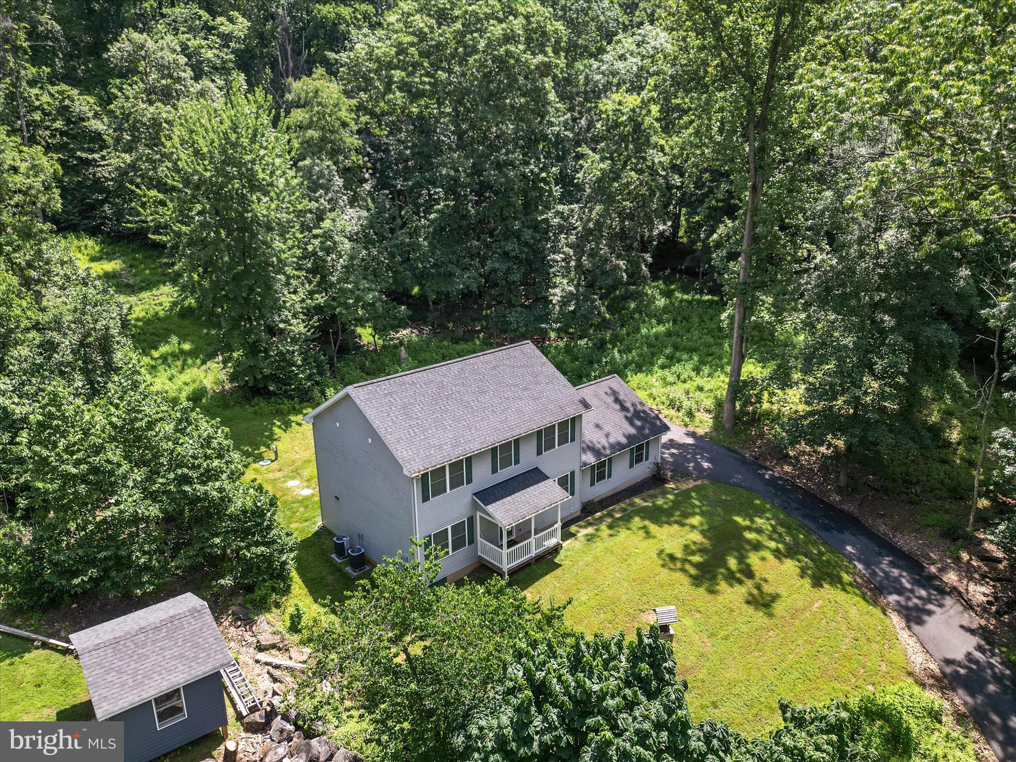 231 Greenfield Road Front Royal, VA 22630 - Photo 34 of 38 an aerial view of a house with swimming pool and trees all around