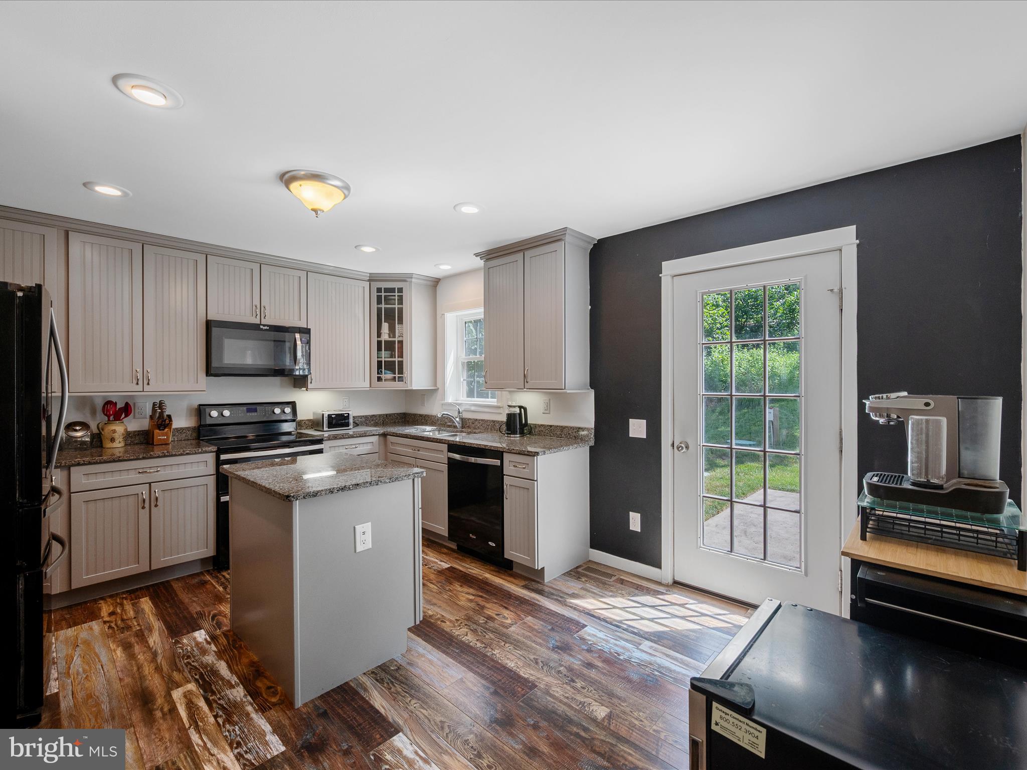231 Greenfield Road Front Royal, VA 22630 - Photo 8 of 38 a kitchen with granite countertop stainless steel appliances and wooden cabinets