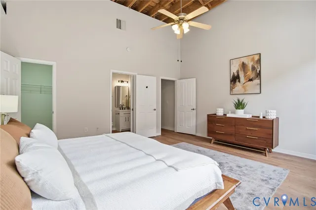 a bedroom with a bed and a dresser