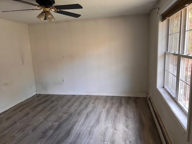 149 River Run Road Hardwick, MA 01031 - Photo 8 of 14 wooden floor in an empty room with a window