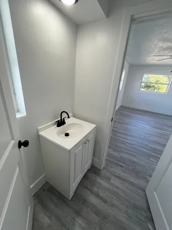 a bathroom with a sink and mirror