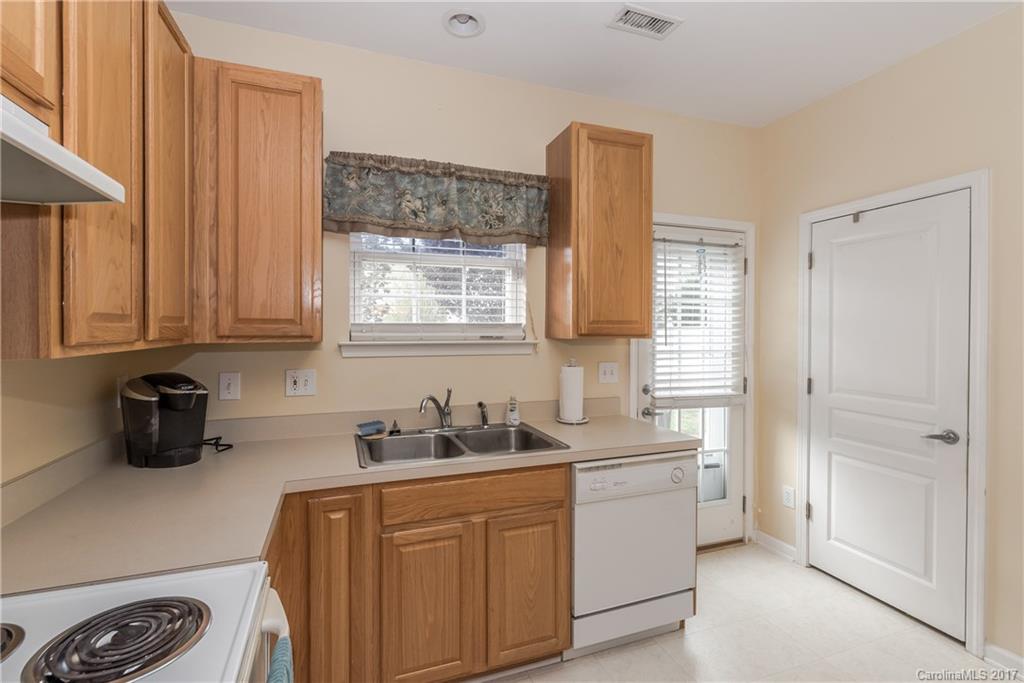 2531 Fossil Stone Lane Fort Mill, SC 29708 - Photo 11 of 21 a kitchen with stainless steel appliances white cabinets and a window