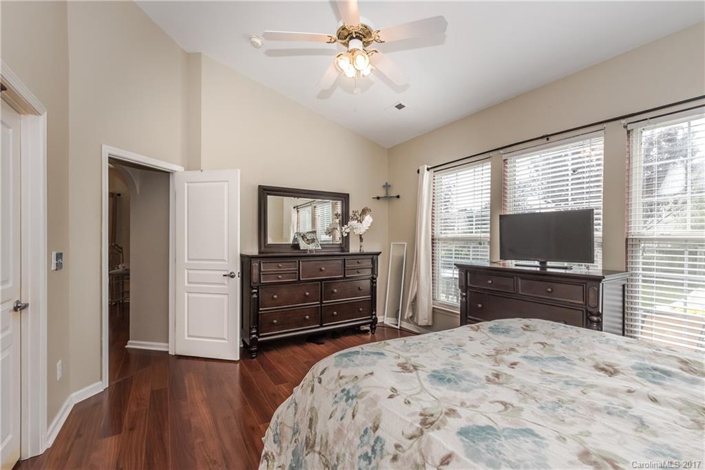 2531 Fossil Stone Lane Fort Mill, SC 29708 - Photo 14 of 21 a bedroom with a bed and a flat screen tv