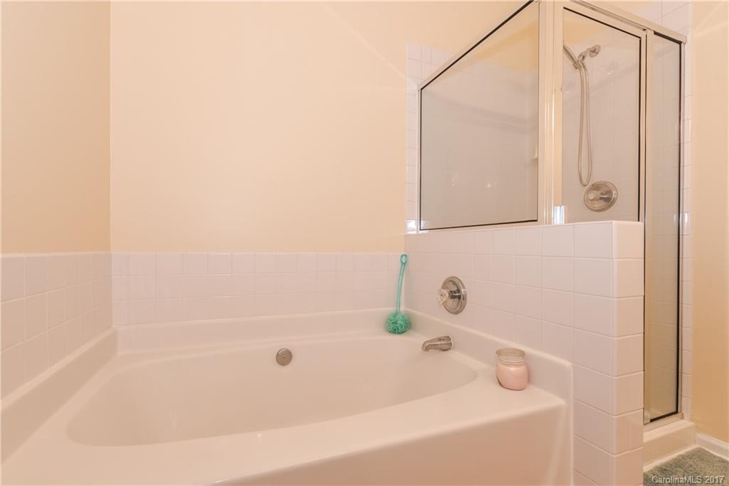 2531 Fossil Stone Lane Fort Mill, SC 29708 - Photo 16 of 21 a bathroom with a bathtub