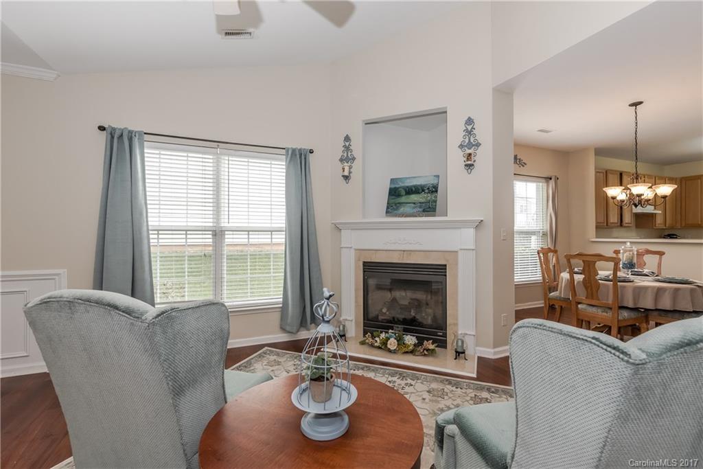 2531 Fossil Stone Lane Fort Mill, SC 29708 - Photo 4 of 21 a living room with furniture and a fireplace