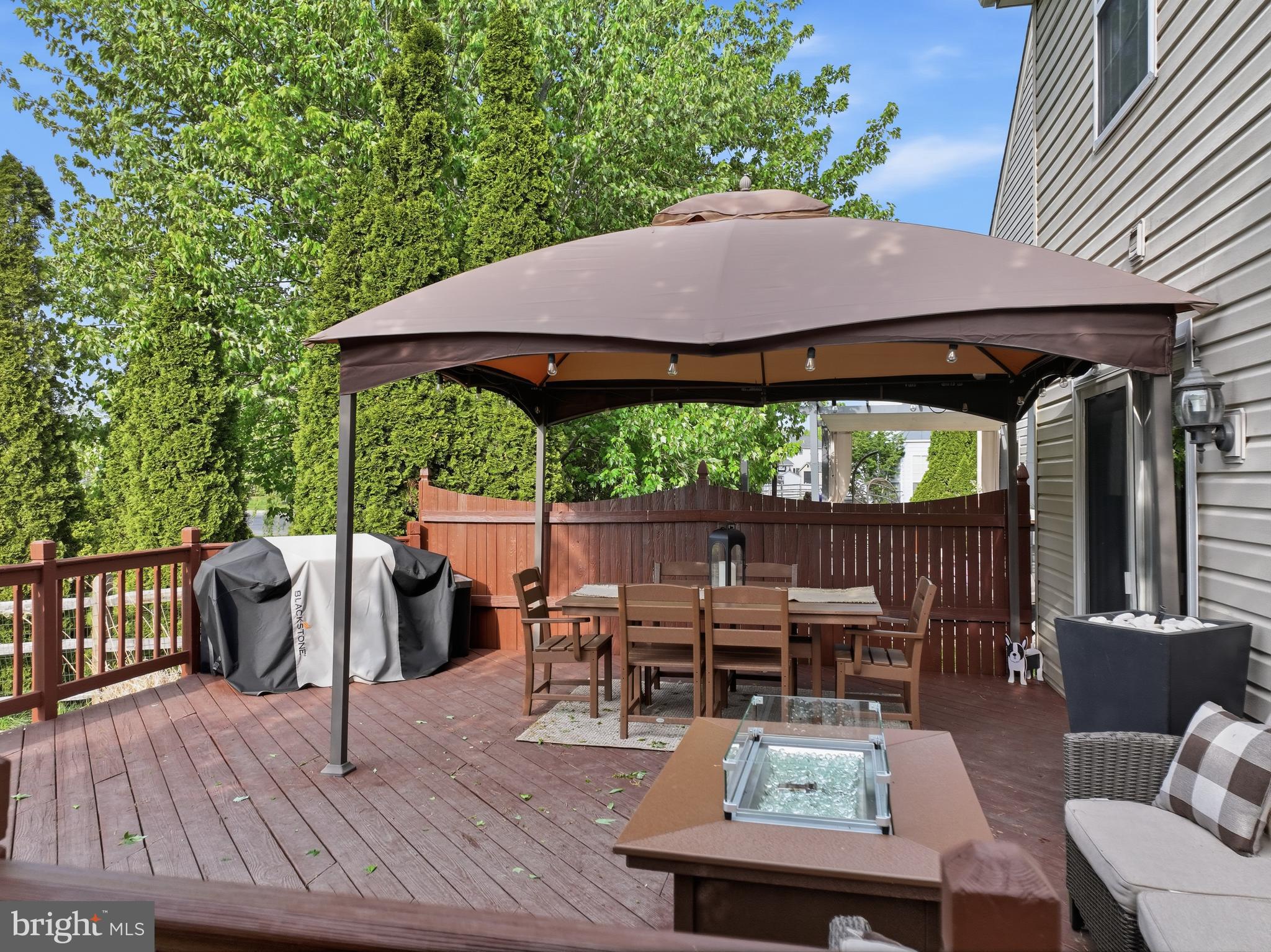 155 Nectar Run Telford, PA 18969 - Photo 28 of 32 a view of patio with table and chairs under an umbrella