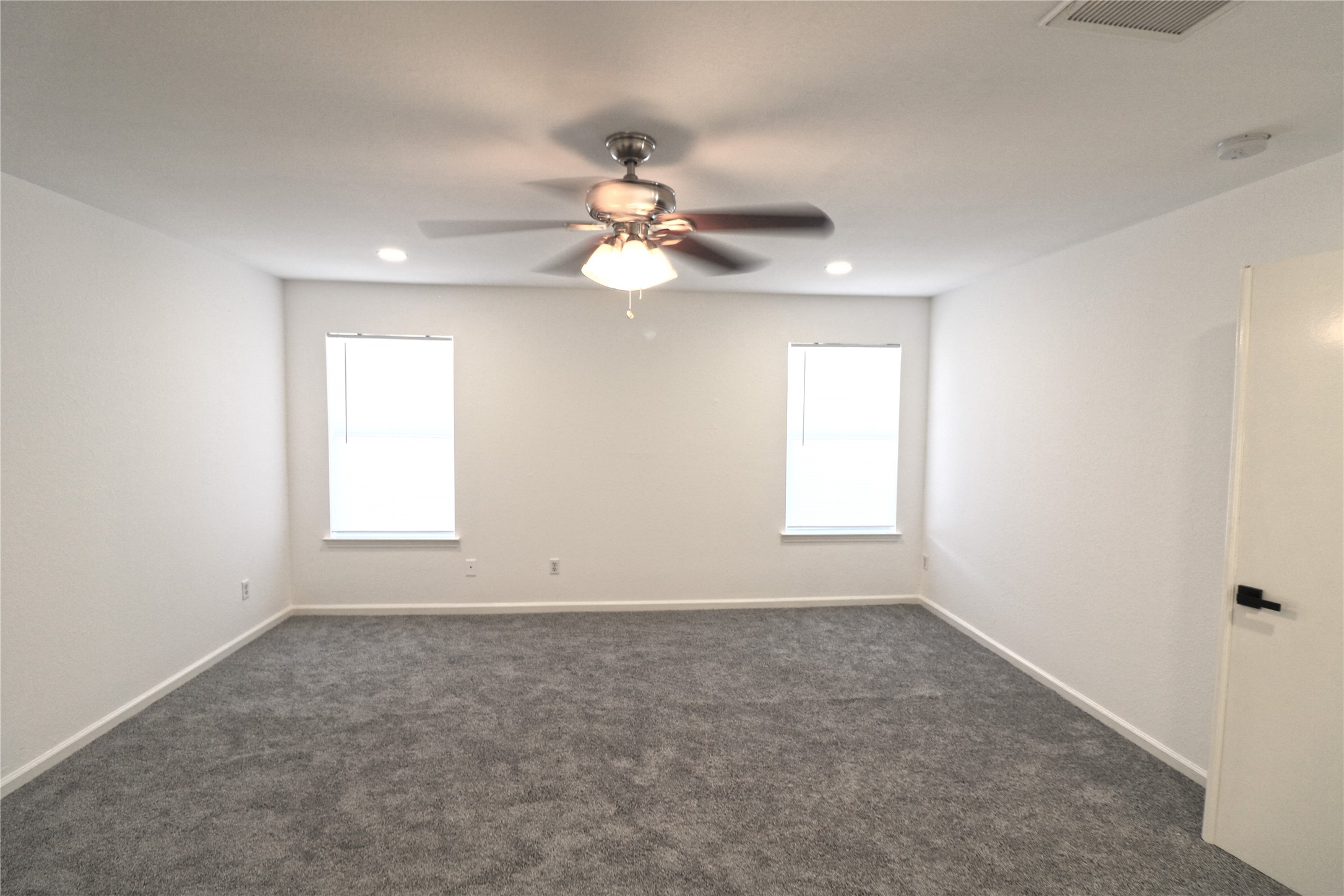 9611 Rads Point Sugar Land, TX 77498 - Photo 17 of 25 wooden floor in an empty room with a window