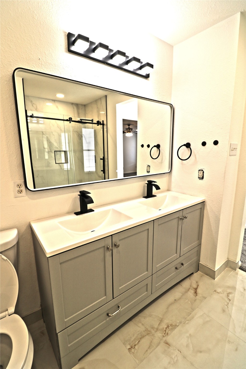 9611 Rads Point Sugar Land, TX 77498 - Photo 23 of 25 a bathroom with a sink and a mirror