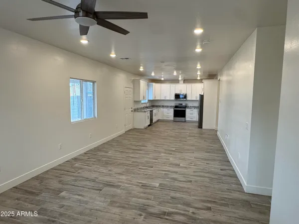 a view of a kitchen with a sink and cabinets