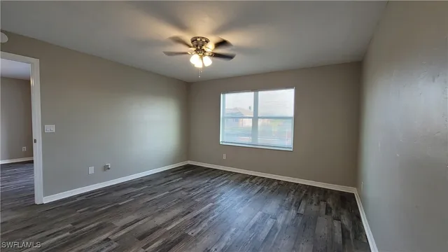 a bathroom with a granite countertop toilet sink and a shower
