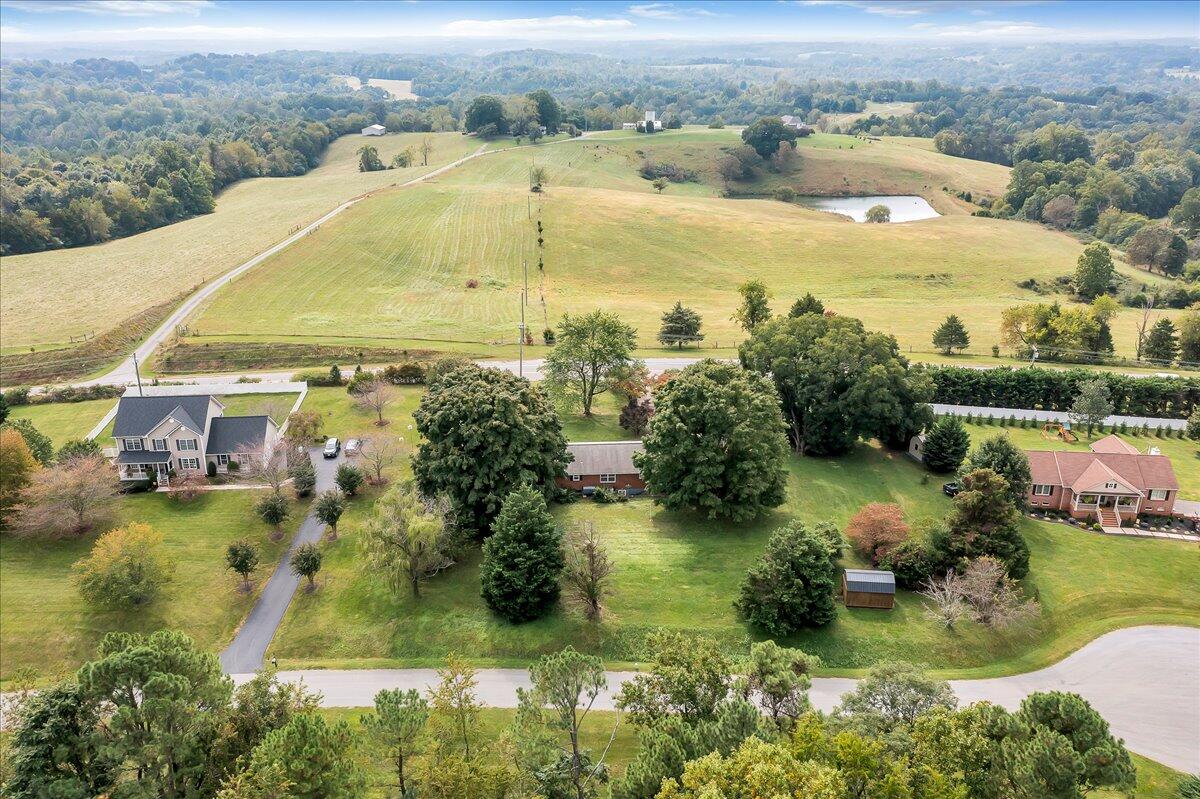 8450 Forest Road Goode, VA 24556 - Photo 11 of 49 an aerial view of residential houses with outdoor space and lake view