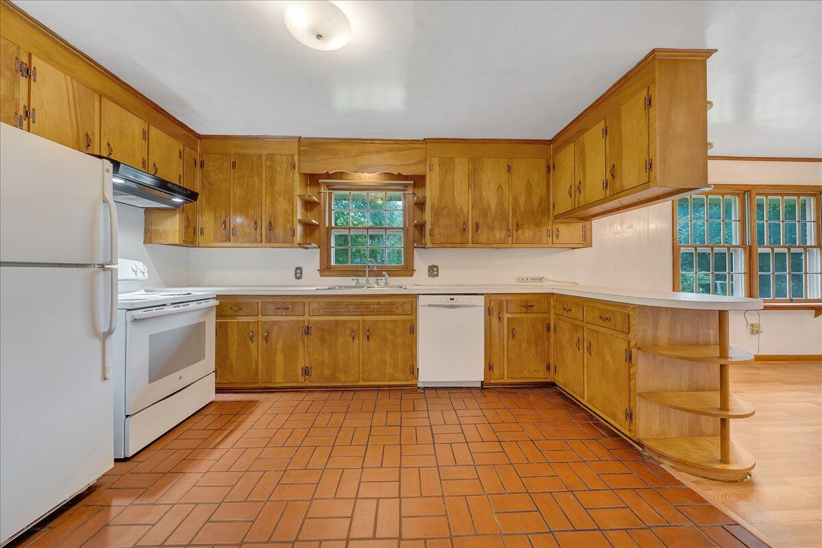 8450 Forest Road Goode, VA 24556 - Photo 22 of 49 a kitchen with a stove sink and cabinets