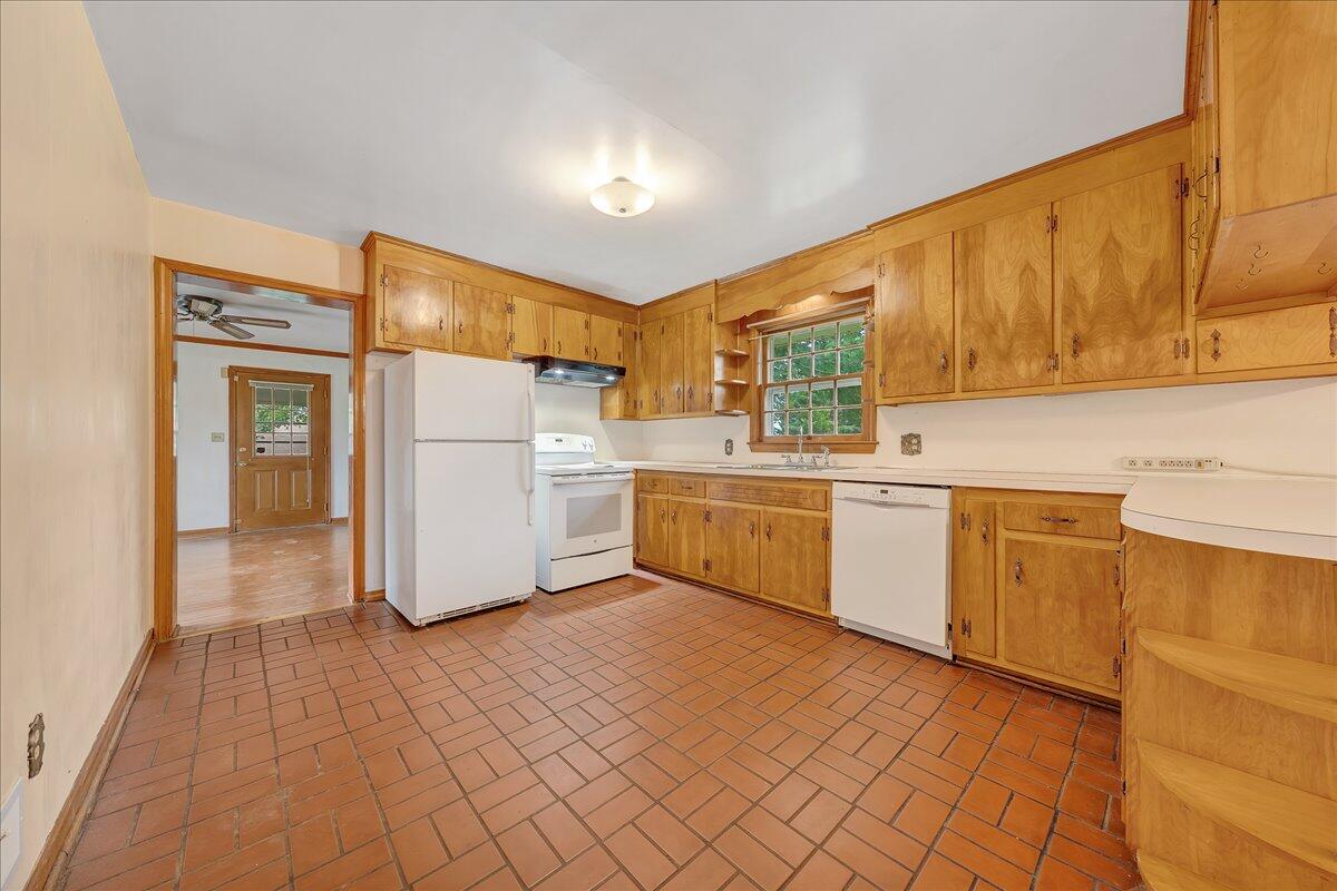 8450 Forest Road Goode, VA 24556 - Photo 23 of 49 a kitchen with a refrigerator sink and cabinets