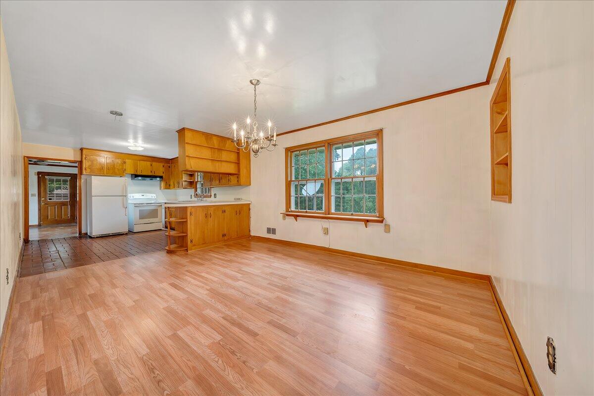 8450 Forest Road Goode, VA 24556 - Photo 26 of 49 a view of a room with wooden floor a ceiling fan and window