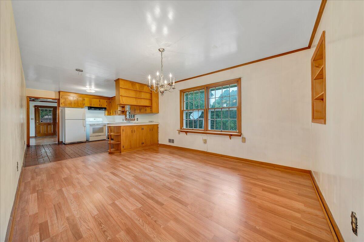 8450 Forest Road Goode, VA 24556 - Photo 27 of 49 a view of a kitchen with a stove cabinets and wooden floor