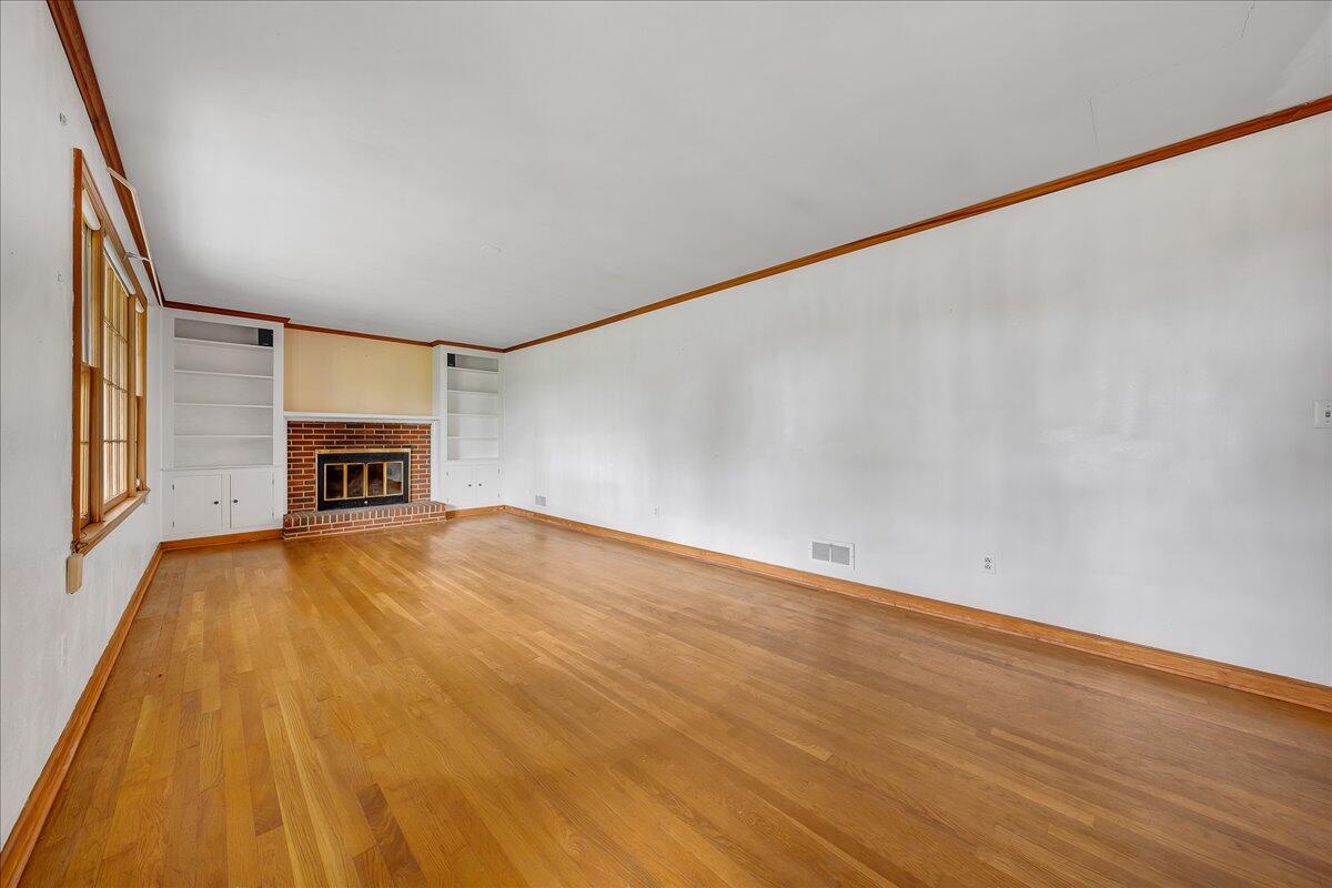 8450 Forest Road Goode, VA 24556 - Photo 29 of 49 a view of empty room with wooden floor and fan