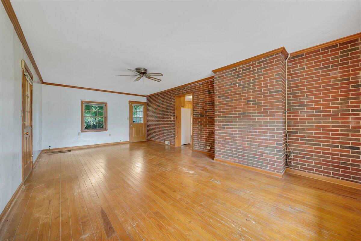 8450 Forest Road Goode, VA 24556 - Photo 32 of 49 a view of an empty room with wooden floor and a window
