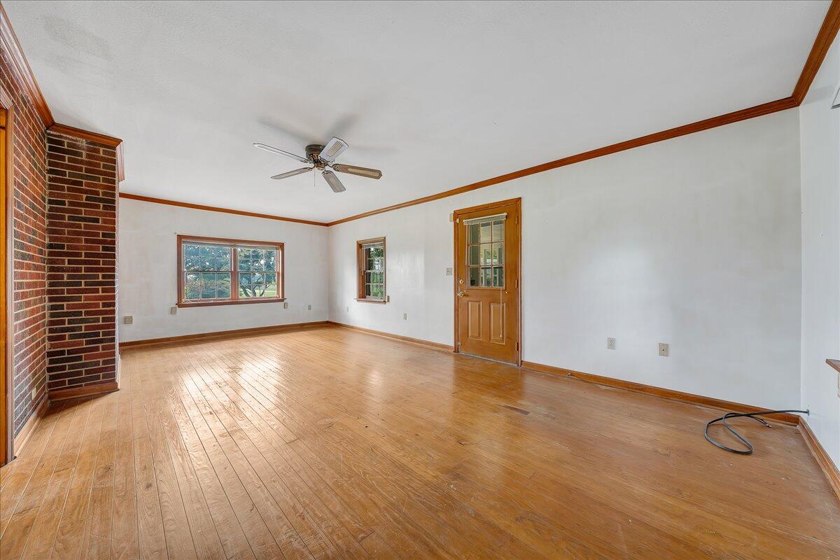 8450 Forest Road Goode, VA 24556 - Photo 34 of 49 wooden floor in an empty room with a window
