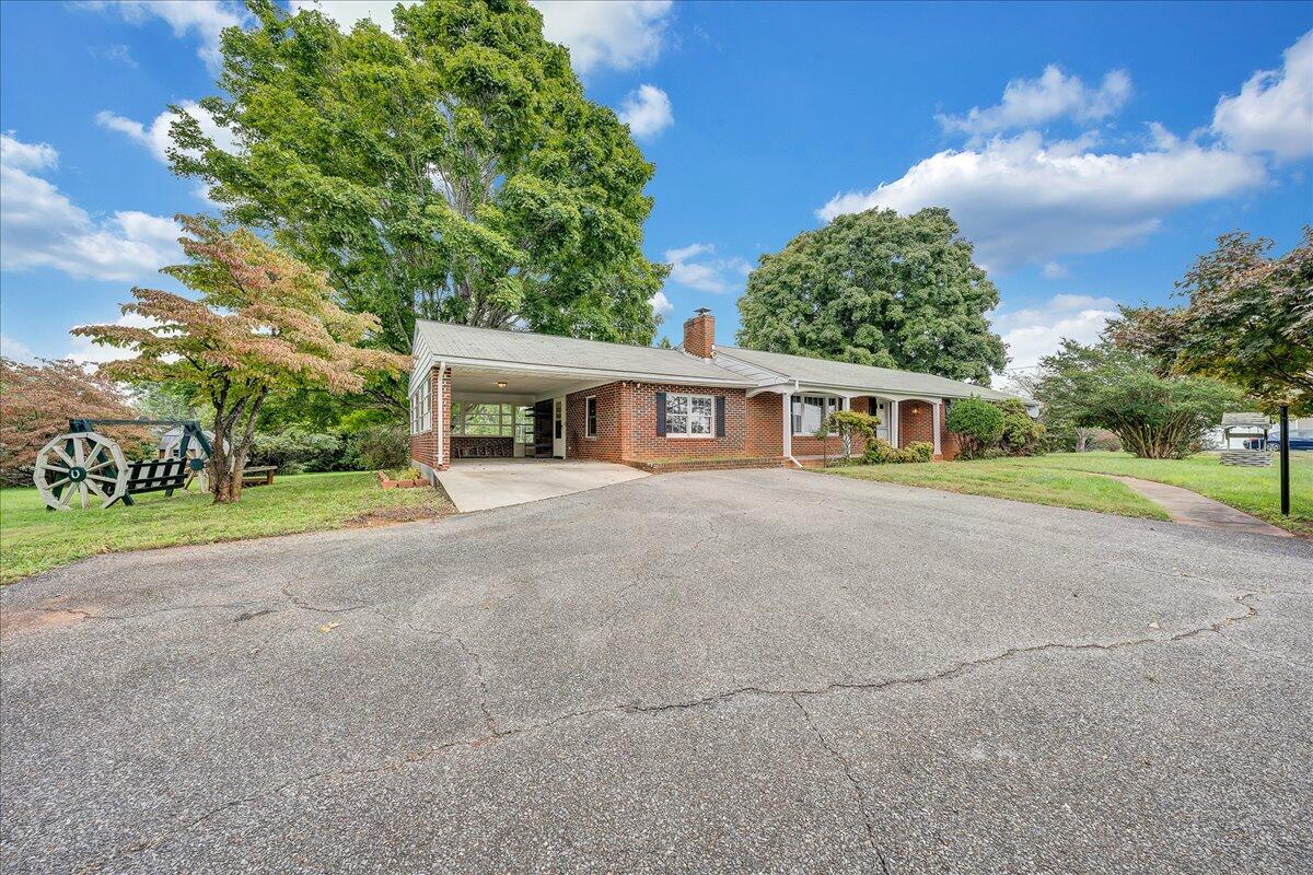 8450 Forest Road Goode, VA 24556 - Photo 7 of 49 a view of house with outdoor space and tree s