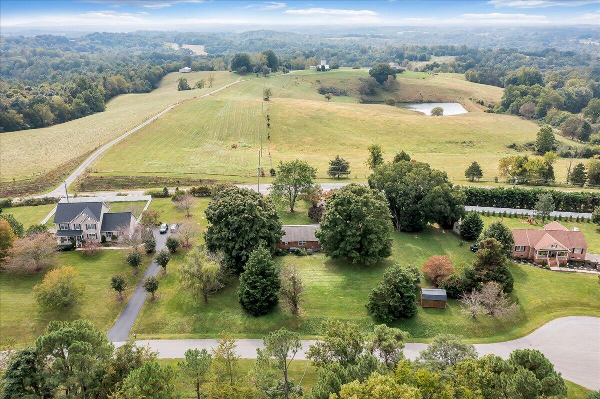 8450 Forest Road Goode, VA 24556 - Photo 10 of 49 an aerial view of residential houses with outdoor space and lake view