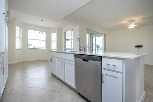 a view of a kitchen counter space and windows