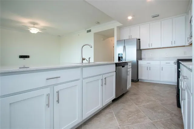 a kitchen with a sink and refrigerator