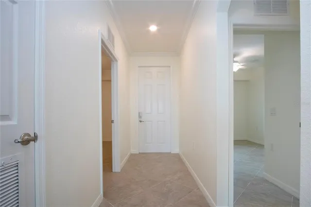 a view of a hallway with a room