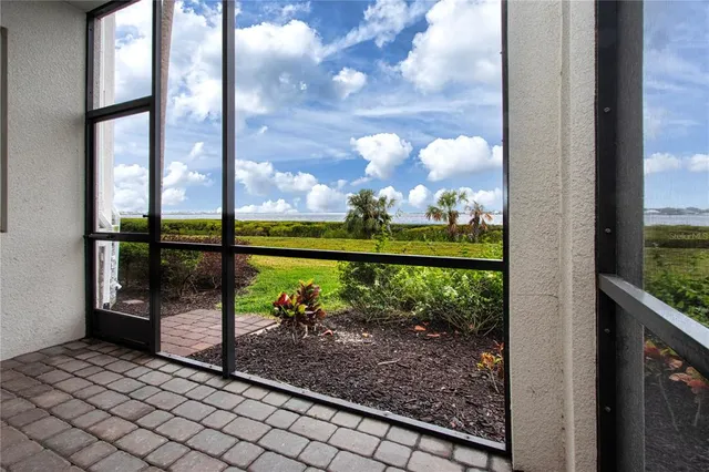 a view of a balcony with lake view and a potted plant