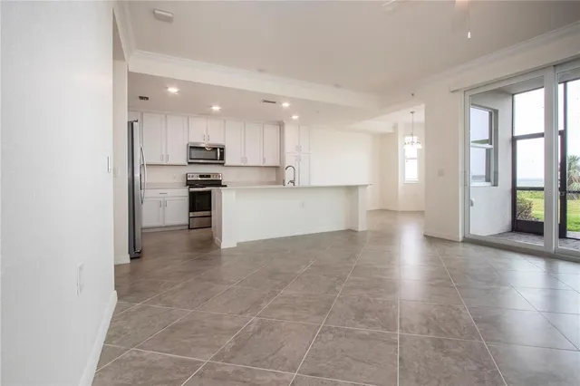 a view of a kitchen with a sink and a stove top oven