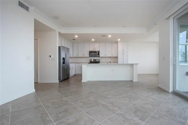 a view of a kitchen with a sink cabinets and a window