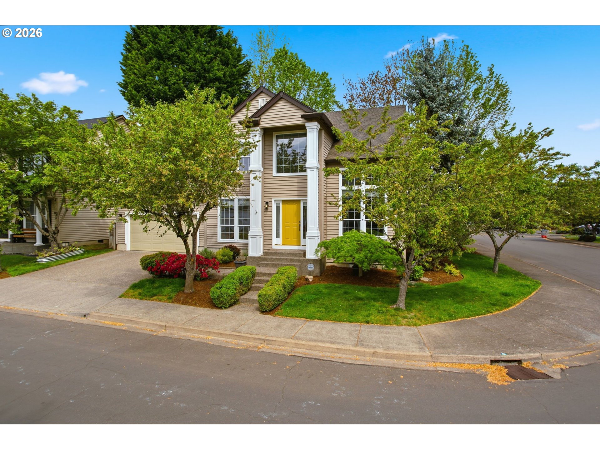 8911 Southwest Gravenstein Lane Tigard, OR 97224 - Photo 1 of 33 a front view of a house with a yard and garage