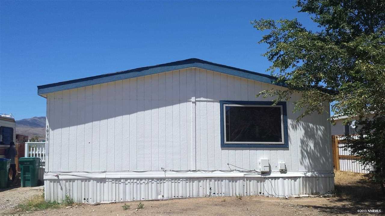 1075 Chisholm Trail Reno, NV 89506 - Photo 1 of 1 a house with trees in the background
