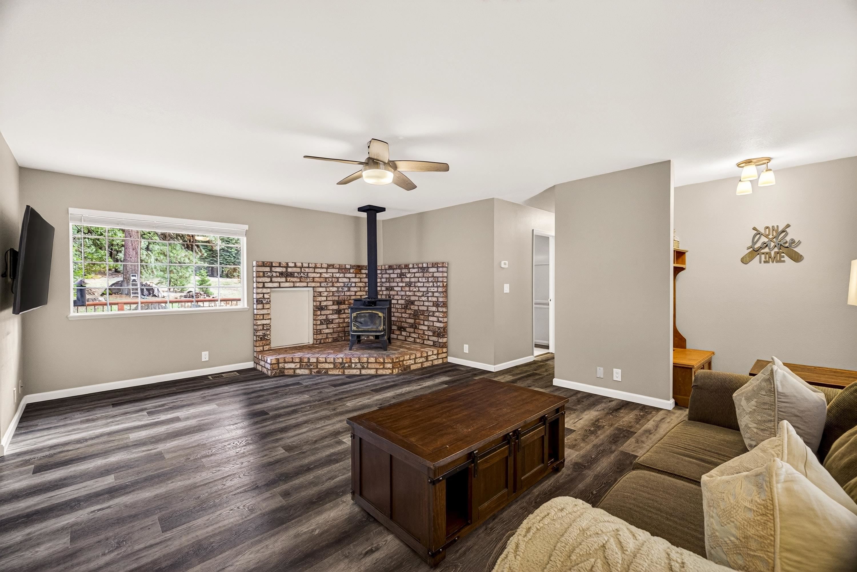 811 Golf Club Road Lake Almanor, CA 96137 - Photo 7 of 42 a living room with furniture and a flat screen tv