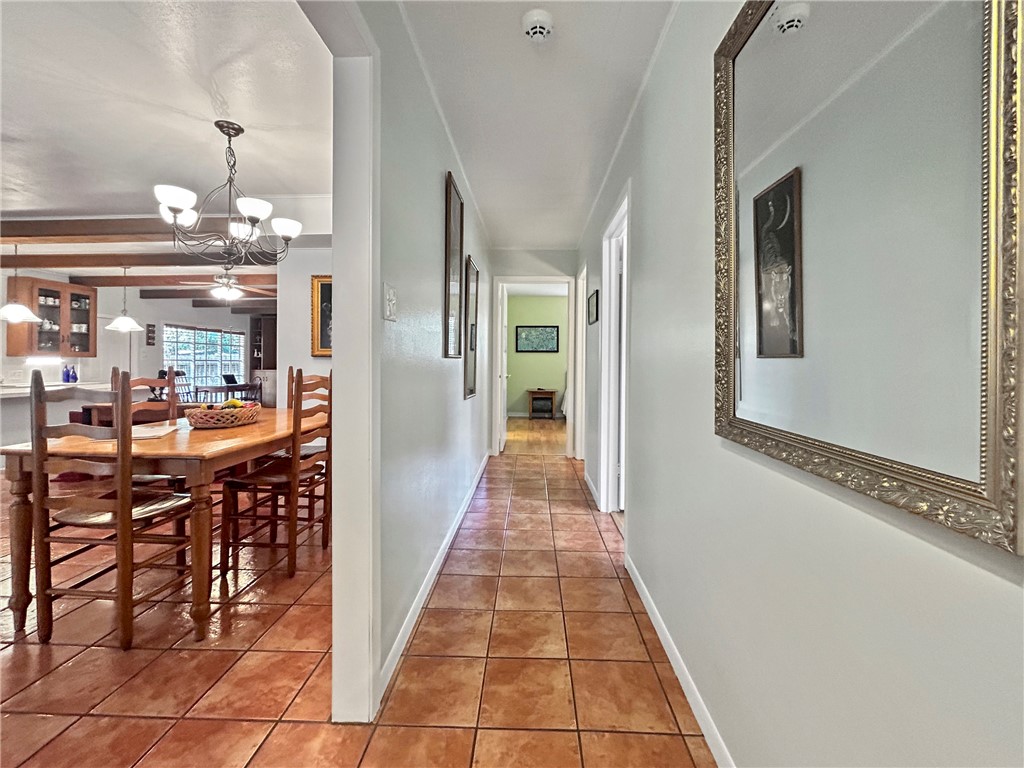 1617 Rose Drive Alice, TX 78332 - Photo 13 of 23 a hallway with dining table and chairs