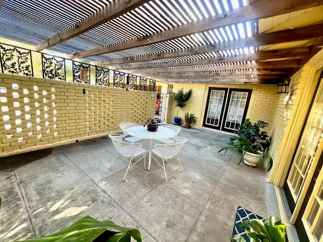 a view of a porch with furniture