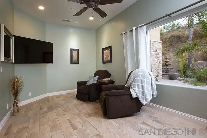 2641 Firebrand Place Alpine, CA 91901 - Photo 13 of 25 a living room with furniture and a flat screen tv