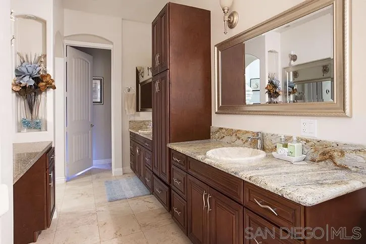 2641 Firebrand Place Alpine, CA 91901 - Photo 16 of 25 a bathroom with a granite countertop double vanity sink and mirror