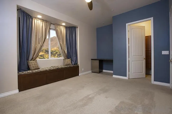 2641 Firebrand Place Alpine, CA 91901 - Photo 20 of 25 an empty room with windows and closet