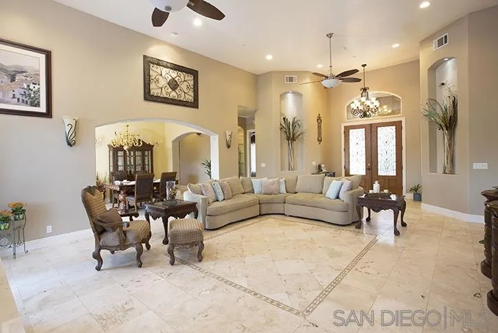 2641 Firebrand Place Alpine, CA 91901 - Photo 6 of 25 a living room with furniture and a chandelier